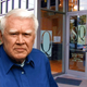 Bud Easler stands outside Studio Quest hair salon.